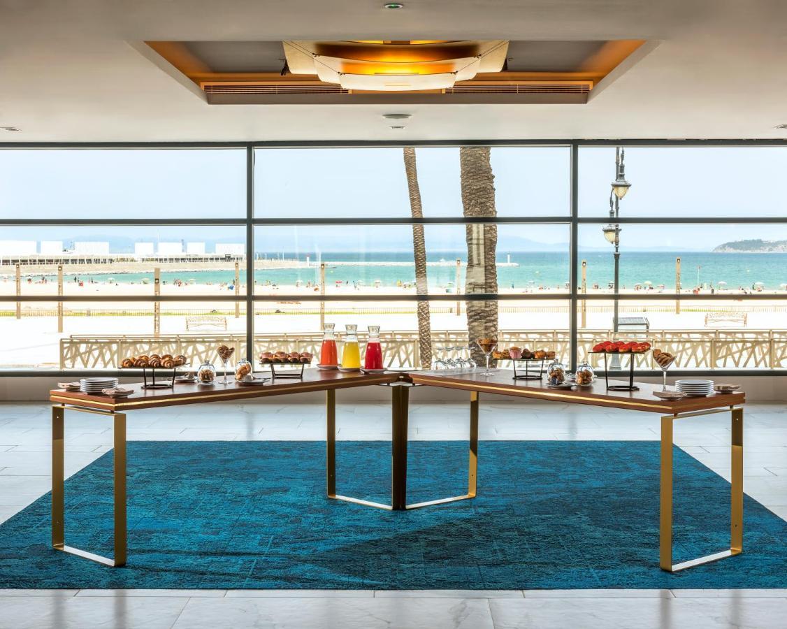 Hotel Barcelo Tanger Exterior foto The lobby at the Hilton Tel Aviv